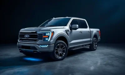 2026 F-150 Lightning Pro electric pickup truck studio shot with charging port open