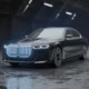 BMW i7 luxury electric sedan front three-quarter view in studio lighting