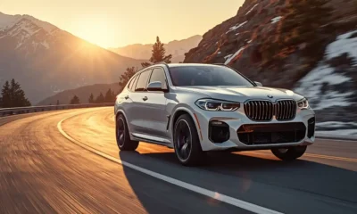 BMW iX M60 electric luxury SUV 2026 in alpine white on mountain highway at golden hour