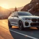BMW iX M60 electric luxury SUV 2026 in alpine white on mountain highway at golden hour