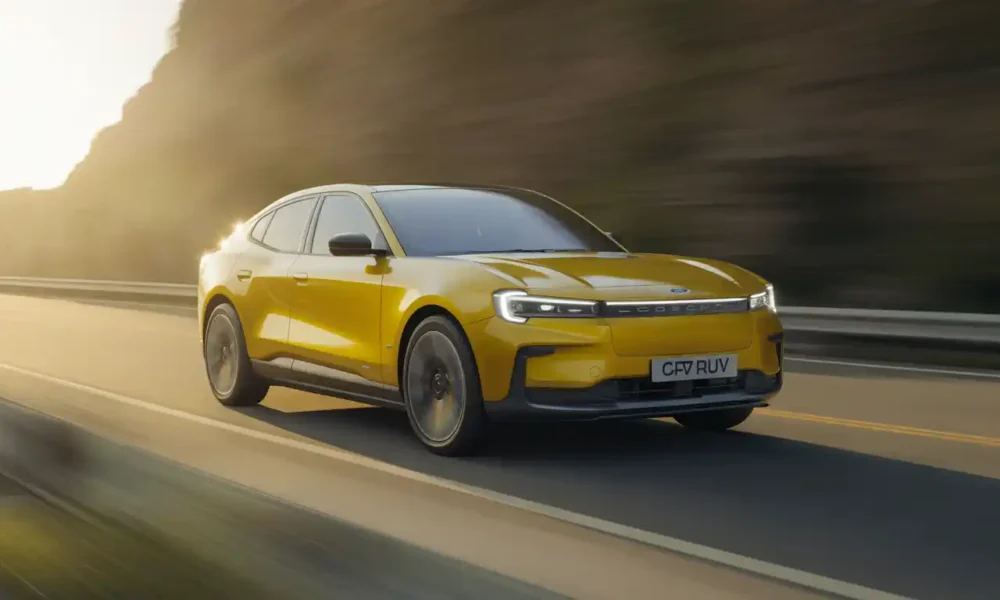 Ford Capri EV 2026 electric coupe SUV in Vivid Yellow driving on open road