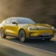 Ford Capri EV 2026 electric coupe SUV in Vivid Yellow driving on open road