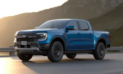 2027 Ford Ranger EV electric pickup truck front three-quarter view in metallic blue
