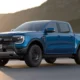 2027 Ford Ranger EV electric pickup truck front three-quarter view in metallic blue