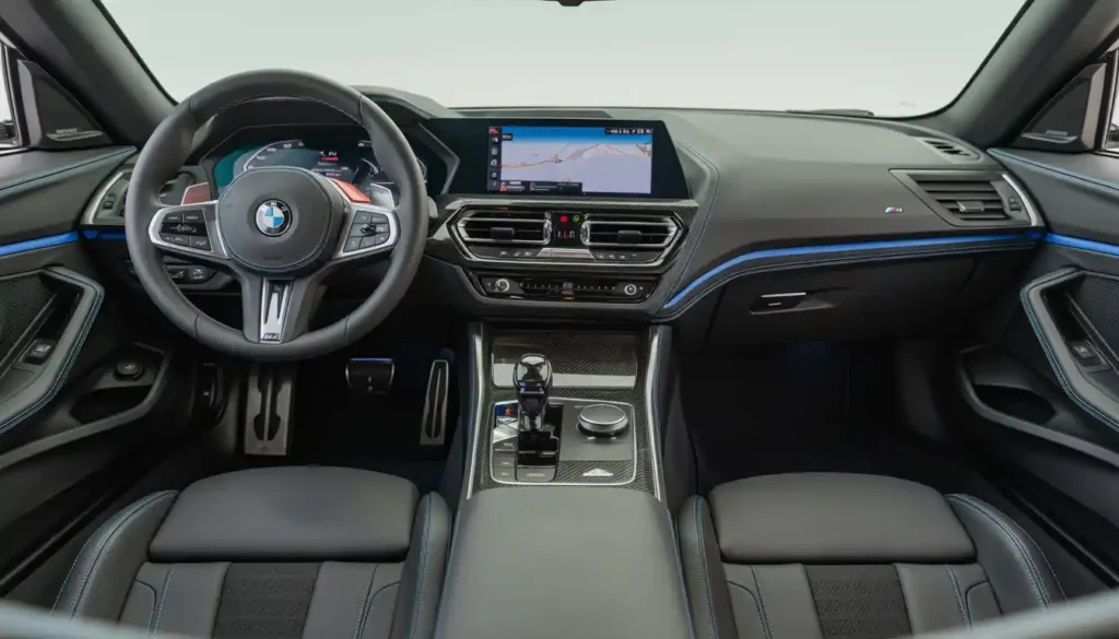 2026 BMW Z4 interior cockpit showing iDrive 10.3 inch screen and M Sport Alcantara seats