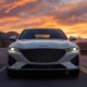 2026 Genesis GV70 luxury SUV parked on a scenic mountain road