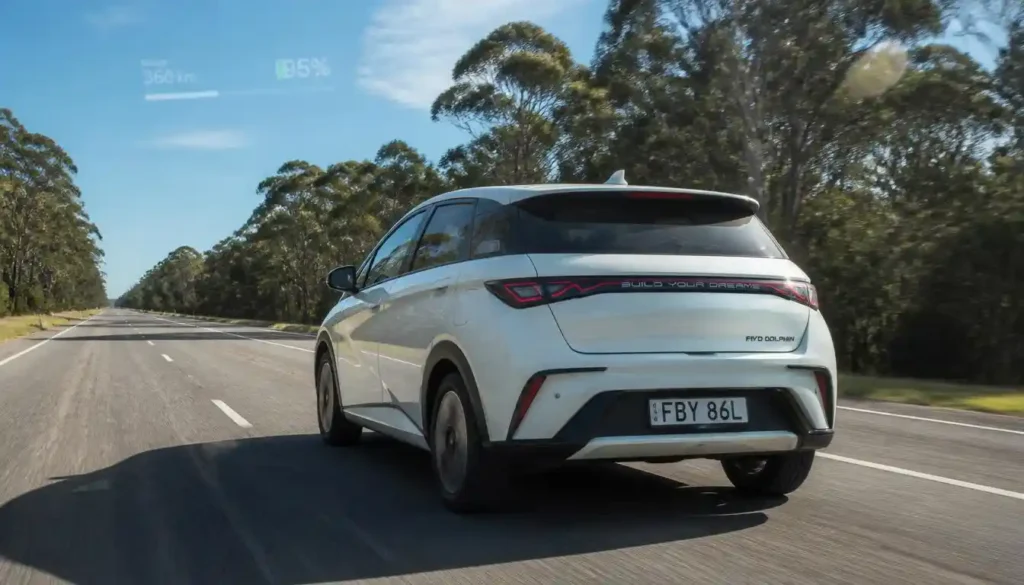BYD Dolphin driving on an open motorway during a real-world range test on a sunny day