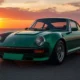 2026 GWM Ora Funky Cat in green parked on an open highway during golden hour, front three-quarter view.
