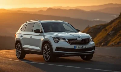 Skoda electric cars lineup shown with a white Enyaq SUV on a mountain road at golden hour.