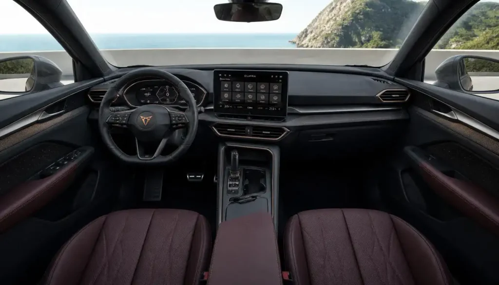 A look inside the CUPRA Terramar's cabin, burgundy seats and a big screen up front.